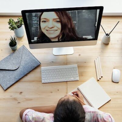 A person sitting at a desk with a computer